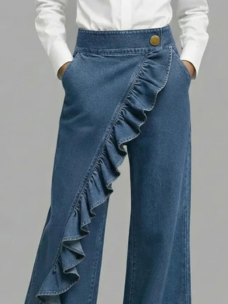 Close-up of ruffled high-rise wide leg jeans. Trendy women's fashion with a unique statement detail.