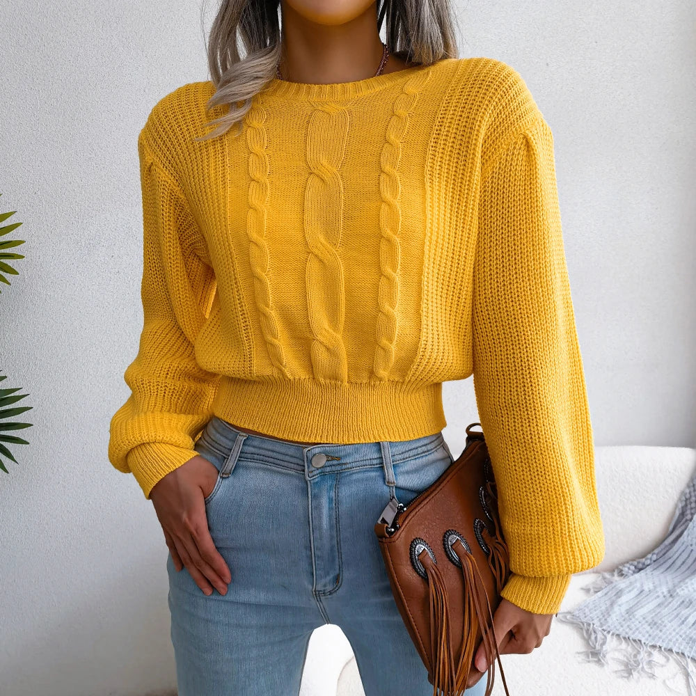 Cozy women's cable knit sweater in a soft, relaxed fit, perfect for everyday fall and winter wear.