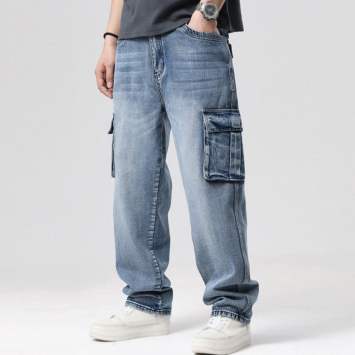 Comfortable men's relaxed fit blue denim cargo jeans, perfect for casual everyday wear.