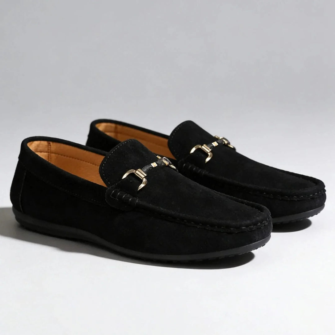 Elegant men's slip-on loafers showcasing a distinctive buckle, enhancing any smart or casual ensemble.