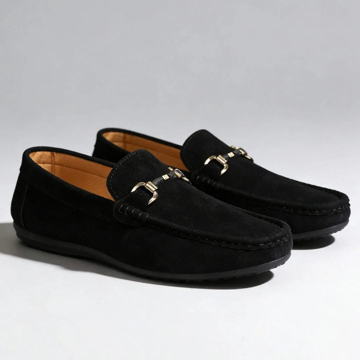 Elegant men's slip-on loafers showcasing a distinctive buckle, enhancing any smart or casual ensemble.