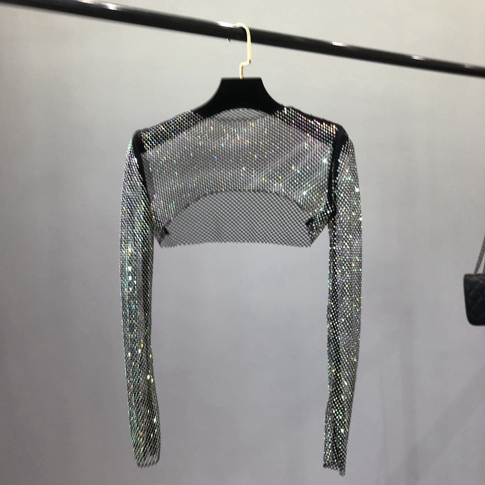 Chic women's clubwear net top, shiny and dazzling for parties. Glamorous fashion for a night out.