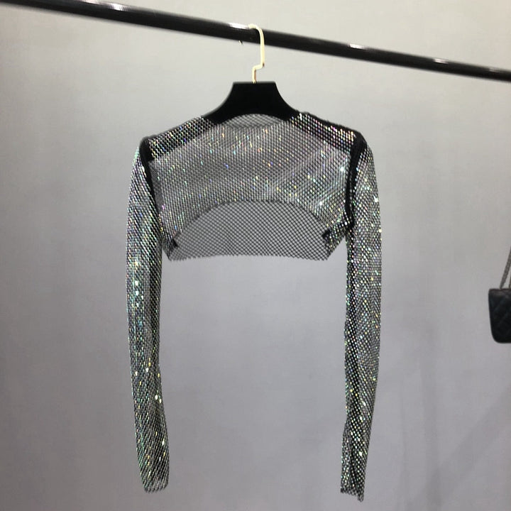 Chic women's clubwear net top, shiny and dazzling for parties. Glamorous fashion for a night out.