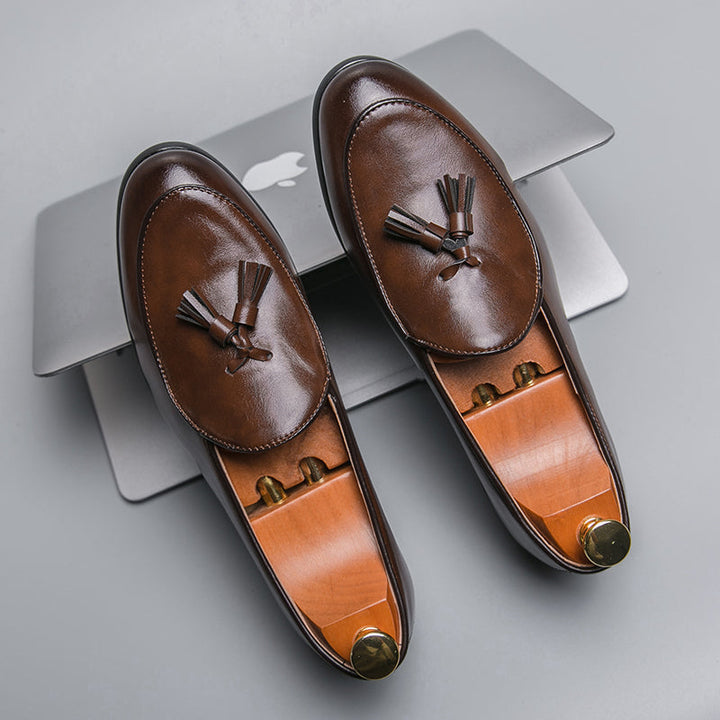 Men's brown tasseled slip-on loafers, elegant and comfortable for formal or casual wear.