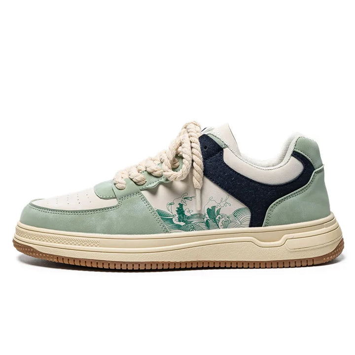 Pair of ArtStride women's sneakers in green & red, featuring unique artistic patterns & exceptional comfort.