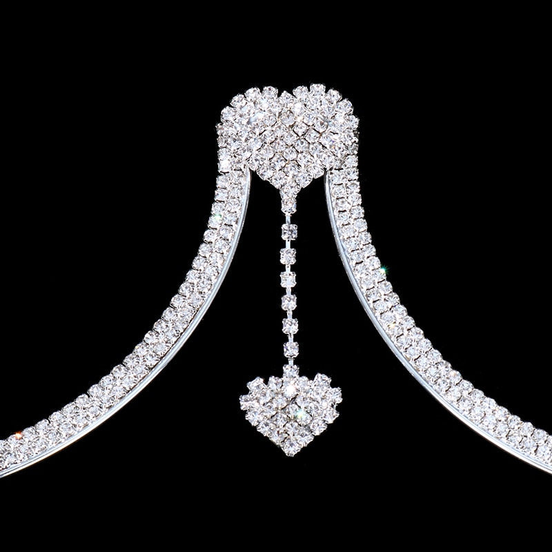 Adjustable sparkling rhinestone body chain for women, an elegant back detail accessory for party wear.
