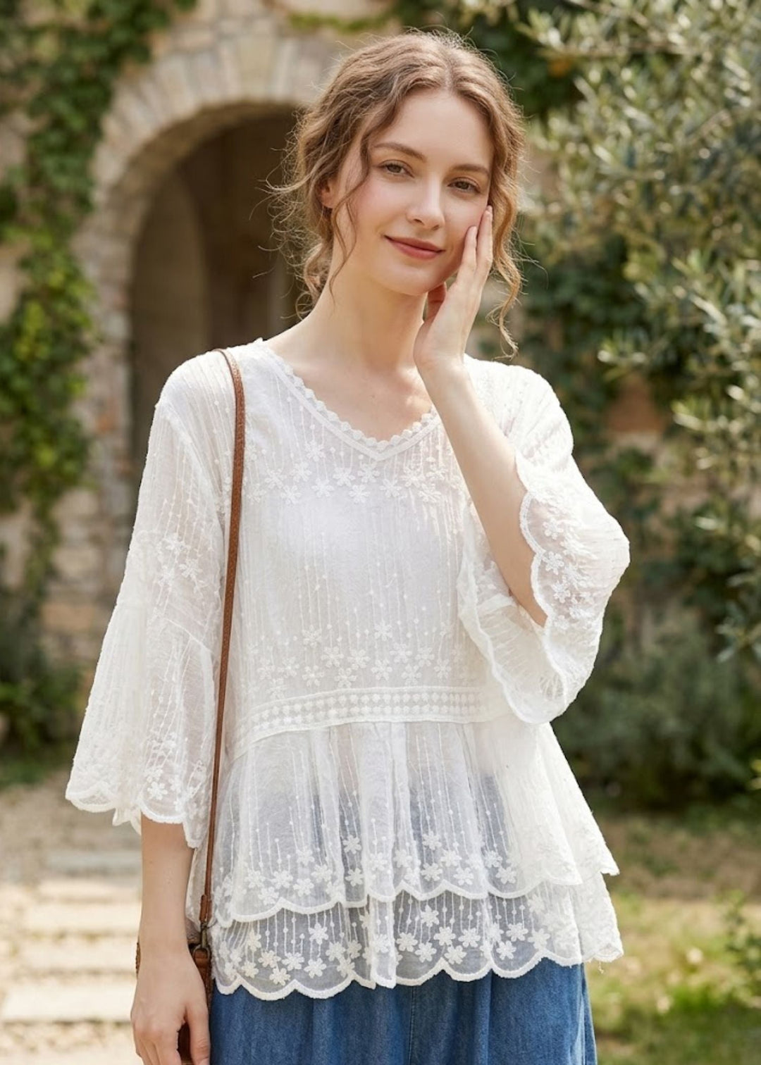 Women's embroidered boho blouse with half sleeves & tiered lace hem. Perfect for spring/summer casual elegance.