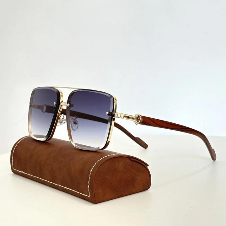 Sleek gold frame unisex sunglasses with dark lenses, offering complete UV400 eye protection.