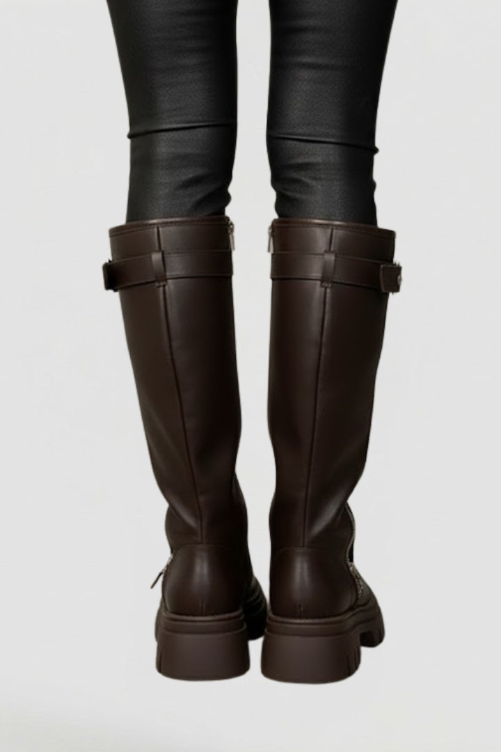 Brown women's knee-high platform boots with a comfortable round toe and practical side zip. Elegant winter footwear.