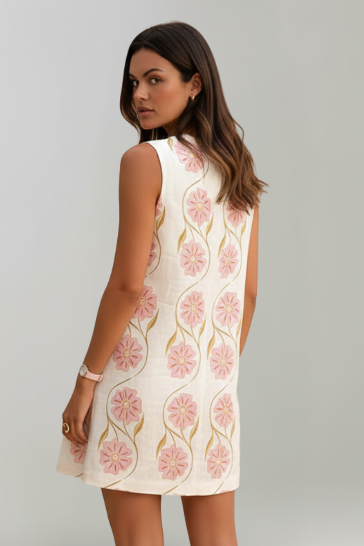 Stylish women's floral print mini dress. Sleeveless A-line design, perfect pink summer dress for casual wear.