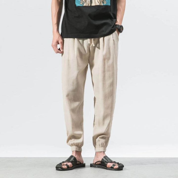 Modern men's joggers, relaxed fit, drawstring for ultimate summer ease.