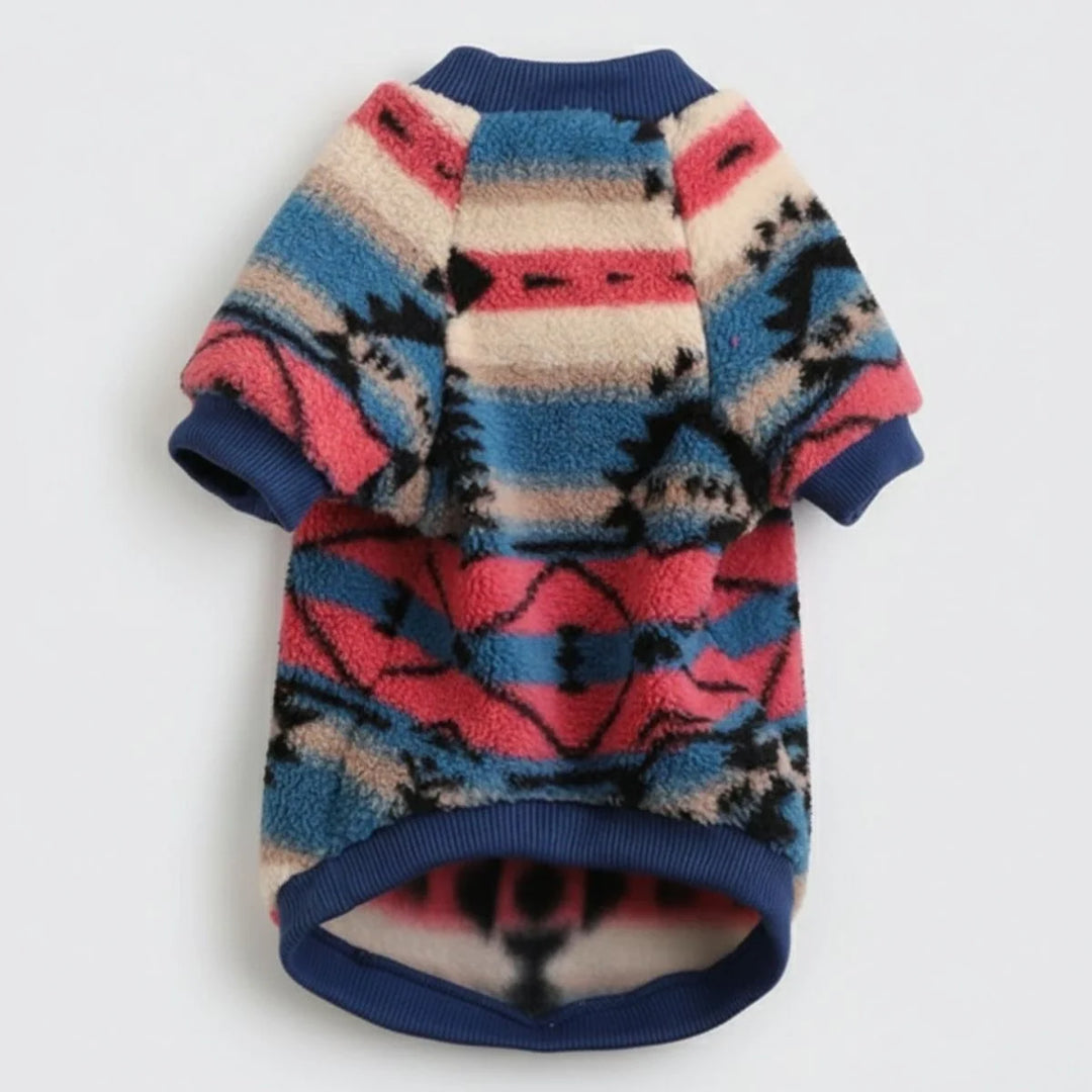 Cute dog modeling a fashionable purple and white striped plush winter sweater, full body.
