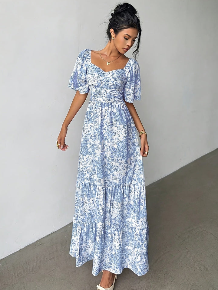Elegant women's tiered floral maxi dress, sweetheart neck, flowing for summer comfort & feminine style.