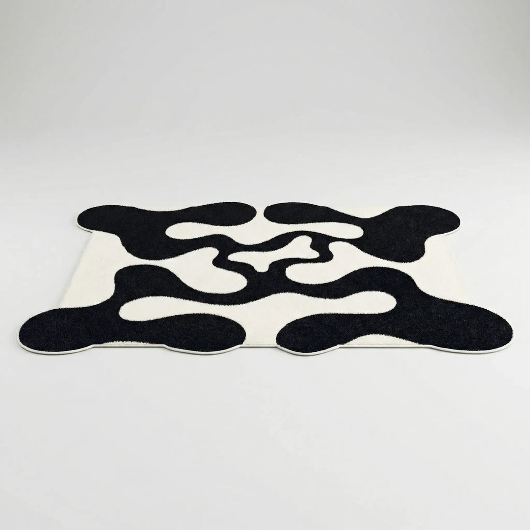 Flowique statement area rug with a captivating abstract wave pattern, perfect for contemporary home decor and living spaces.