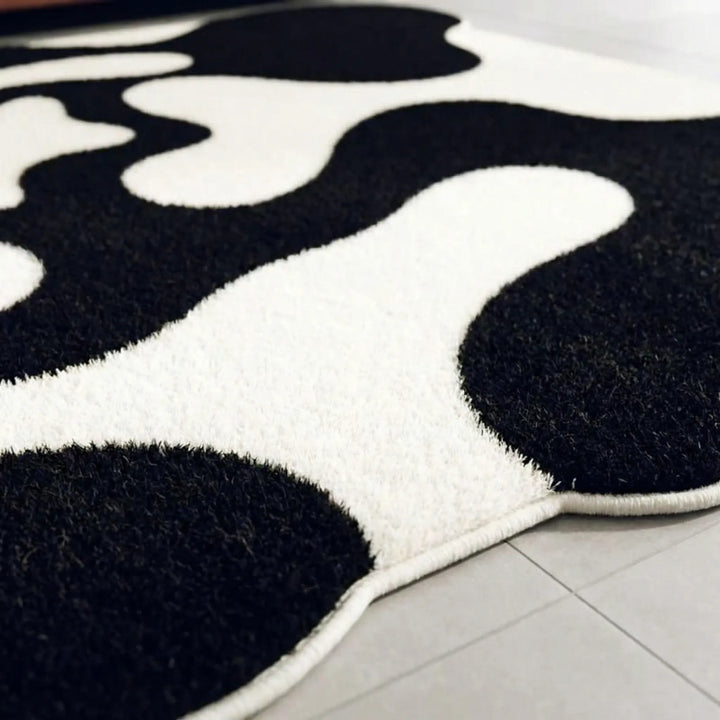 Modern area rug featuring a unique abstract wave pattern. Enhance your contemporary home decor with this stylish Flowique floor covering.