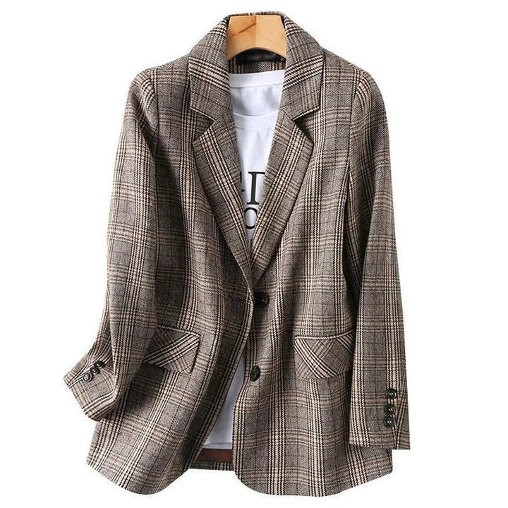 Stylish men's tailored plaid blazer. A classic smart casual jacket, perfect layering piece for modern men's fashion.