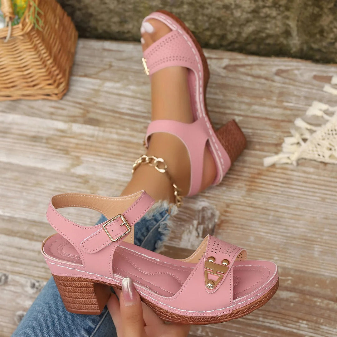 Fashionable women's summer sandals. Cushioned cross-strap design with a comfortable block heel and platform.