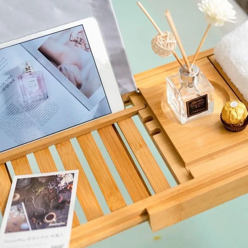 Unisex bamboo bathtub caddy for ultimate spa relaxation. Organizes bath essentials, perfect for self-care.
