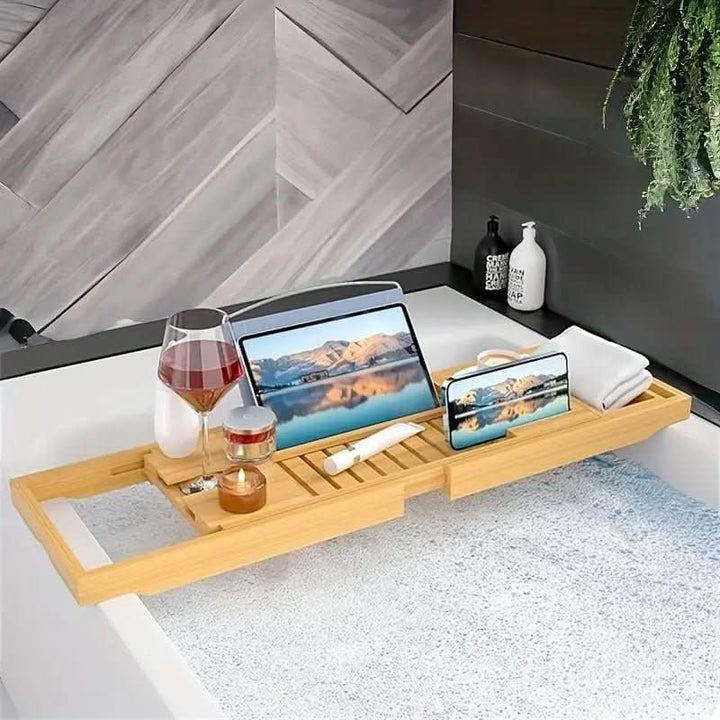 Luxury adjustable bamboo bath tray with slots for phone, book & wine. Perfect self-care bathtub caddy.