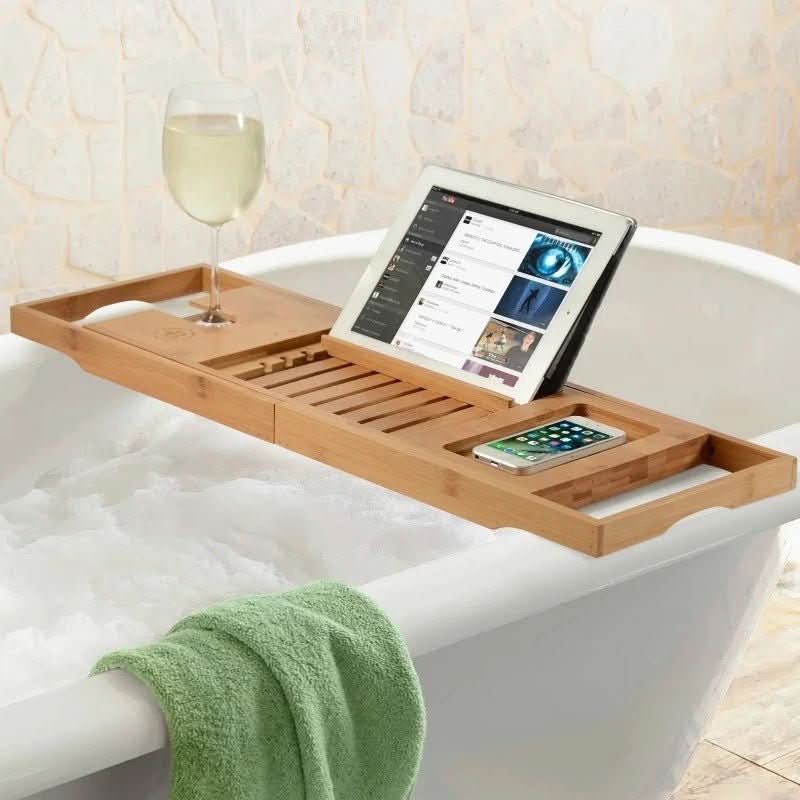 Stylish eco-friendly bamboo bathtub caddy. Adjustable bath accessory, perfect for modern bathroom decor.