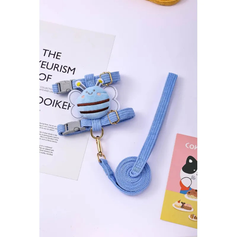 Detail shot of the sturdy clasp on the adjustable bee motif dog harness, a durable pet accessory.