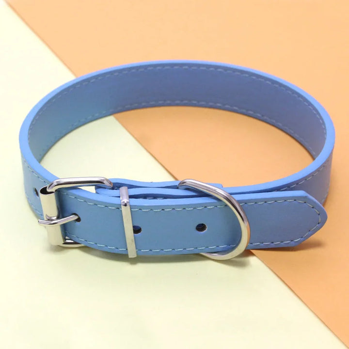 Padded black PU leather dog collar, adjustable for all dogs, comfortable pet accessory.