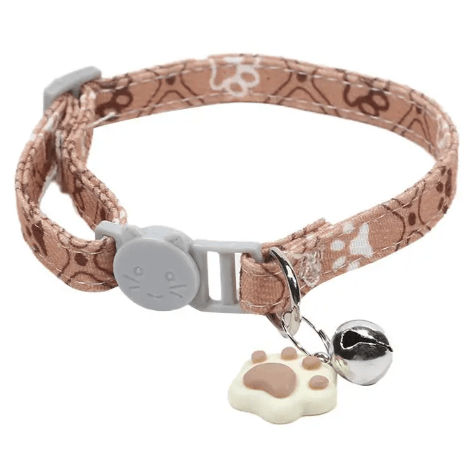 Cute pink adjustable cat collar with paw prints and safety bell for kittens and small pets.