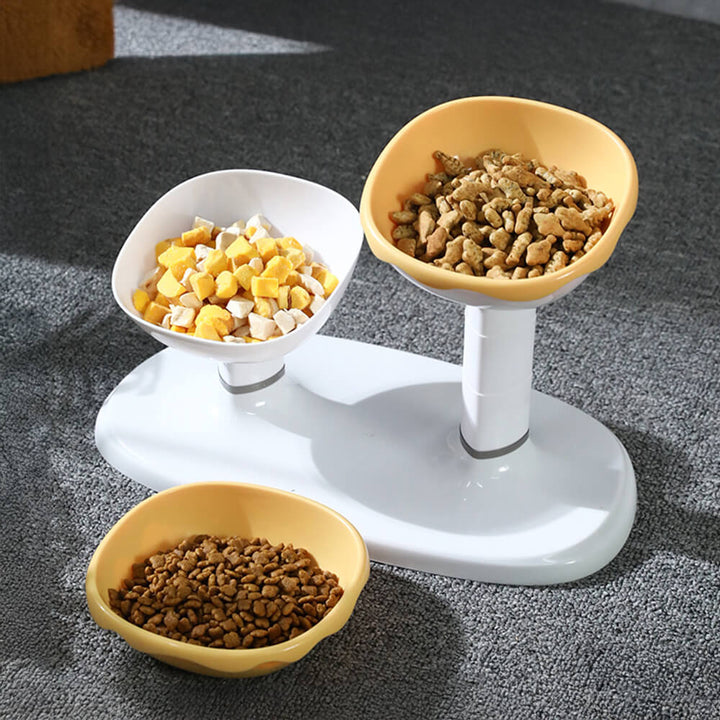 Close-up of a white adjustable double pet feeding bowl showing ceramic bowls and anti-slip base for pets