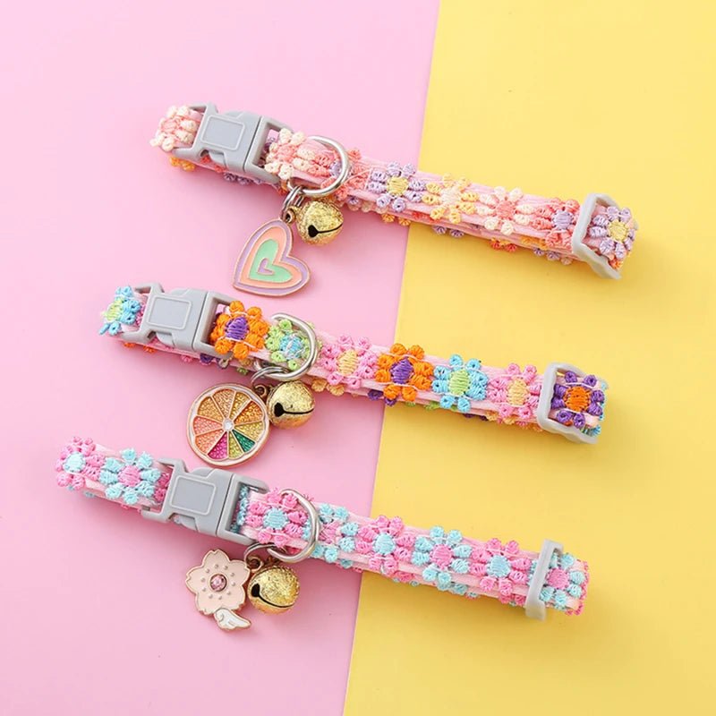 Close-up of an adjustable pet collar with a delicate floral print and tiny bell