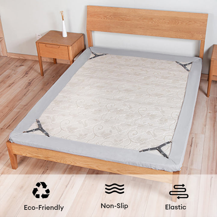 Corner view of a bed with white sheets held firmly in place by adjustable non-slip straps