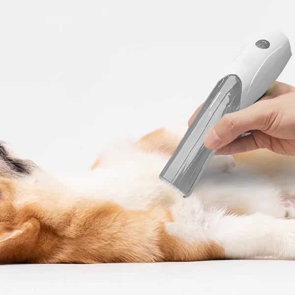 Grooming tool for pets, adjustable deshedding vacuum attachment for effective hair removal and clean pet.