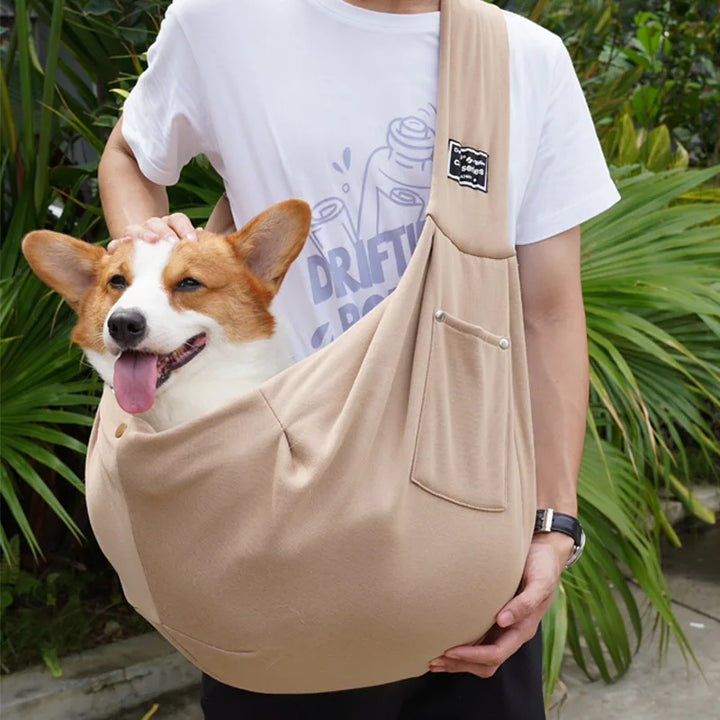 Breathable pet travel sling, perfect for carrying small dogs comfortably & securely on-the-go.