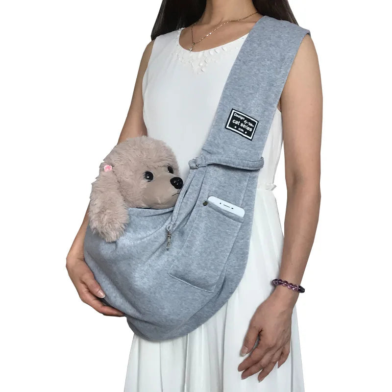 Comfortable cat sling carrier with adjustable shoulder strap, ideal for hands-free travel & daily errands.