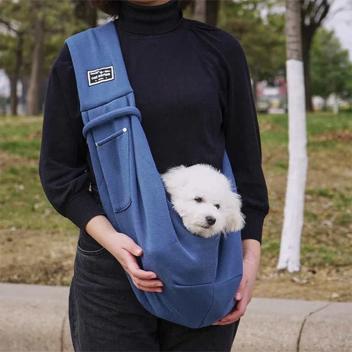 Small pet carrier sling, offering a cozy & secure space for your furry friend during outings.