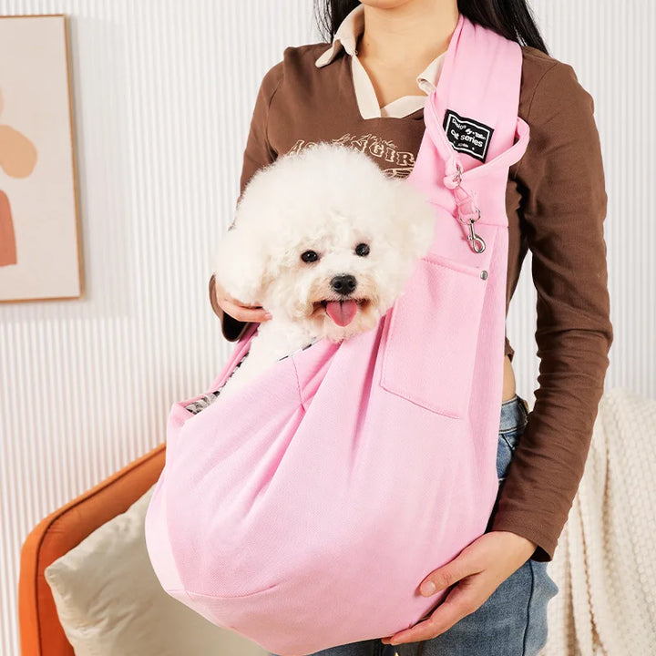 Front view of an adjustable pet sling carrier, designed for hands-free comfort for small dogs & cats.