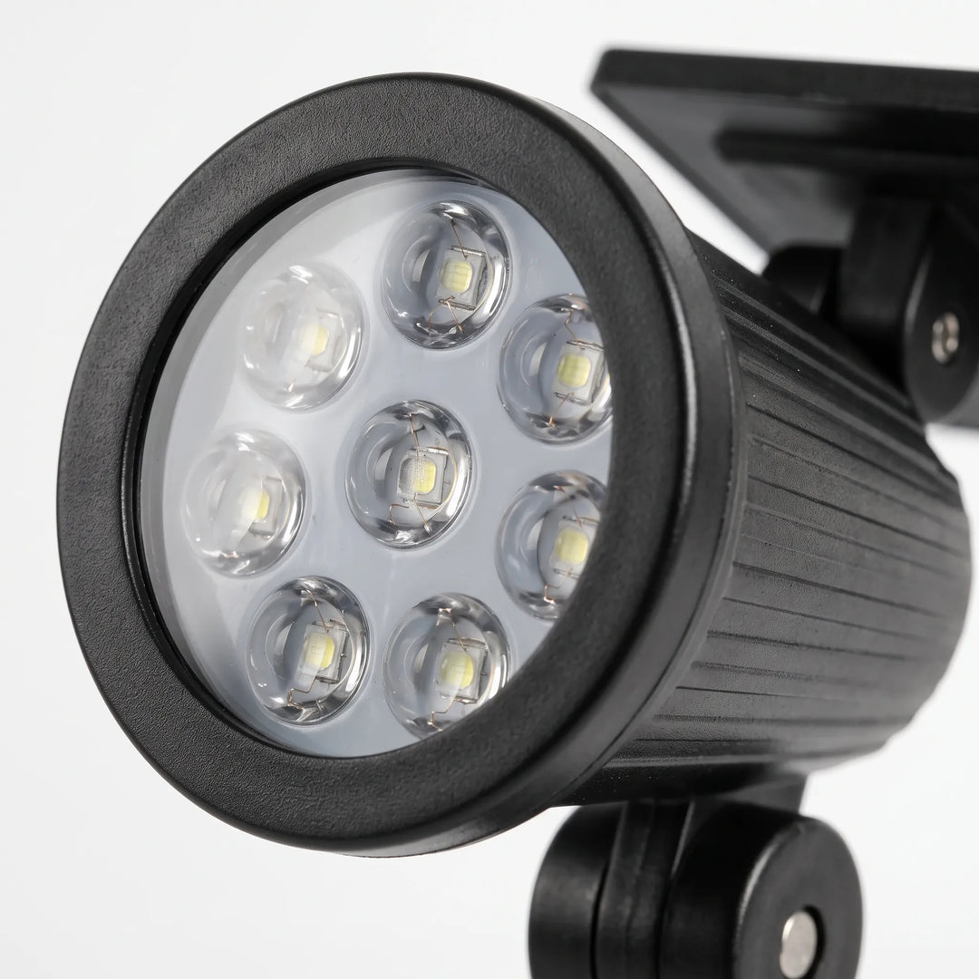 Bright LED solar garden spotlight for pathway lighting & outdoor home decor.