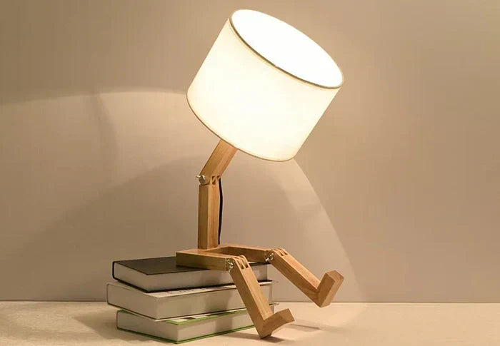 Modern bedside lamp: natural wood robot design with adjustable light & convenient integrated storage.