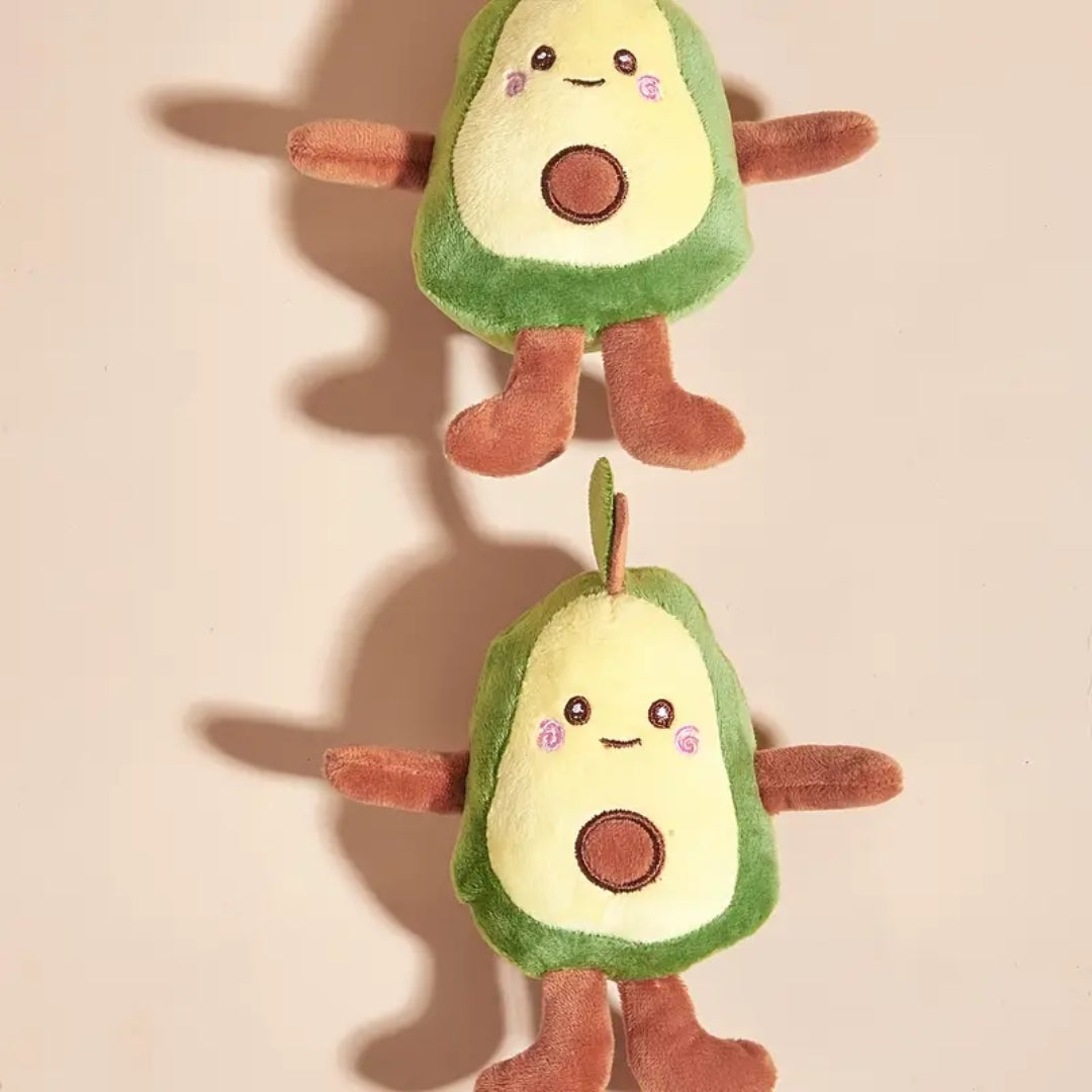 Close-up of a smiling avocado plush pet toy with squeaker, stimulating play for pets
