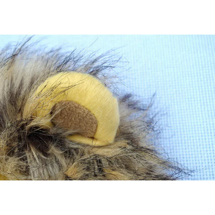Close-up of a cat looking regal in a comfortable lion's mane pet costume, great for any feline.