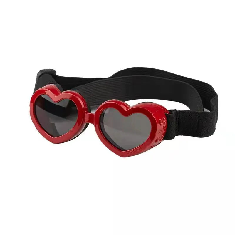 Side view of a dog wearing cute heart-shaped UV protection sunglasses, ensuring pet eye safety.