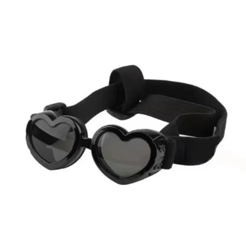 Heart-shaped dog sunglasses on a white background, highlighting UV protection and adjustable strap.