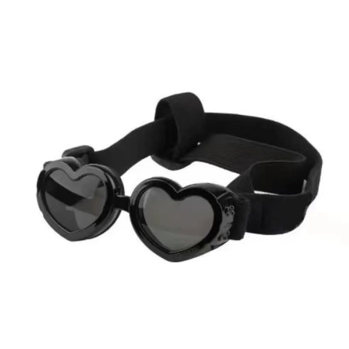 Heart-shaped dog sunglasses on a white background, highlighting UV protection and adjustable strap.