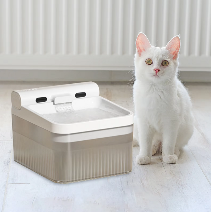 Side view of unique elephant-shaped pet water fountain, featuring advanced triple filtration system.