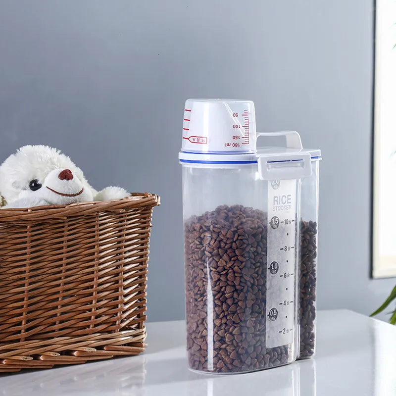 Large capacity dry food dispenser with included measuring cup for rice, pet food, or grains.