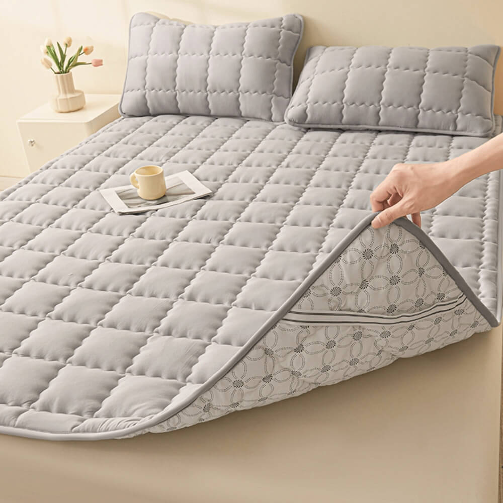 Unrolled all-season breathable quilted non-slip mattress topper, ready to be placed on a bed