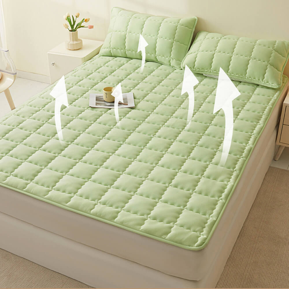 Top-down view of the white all-season non-slip mattress topper, ready for bedding layers