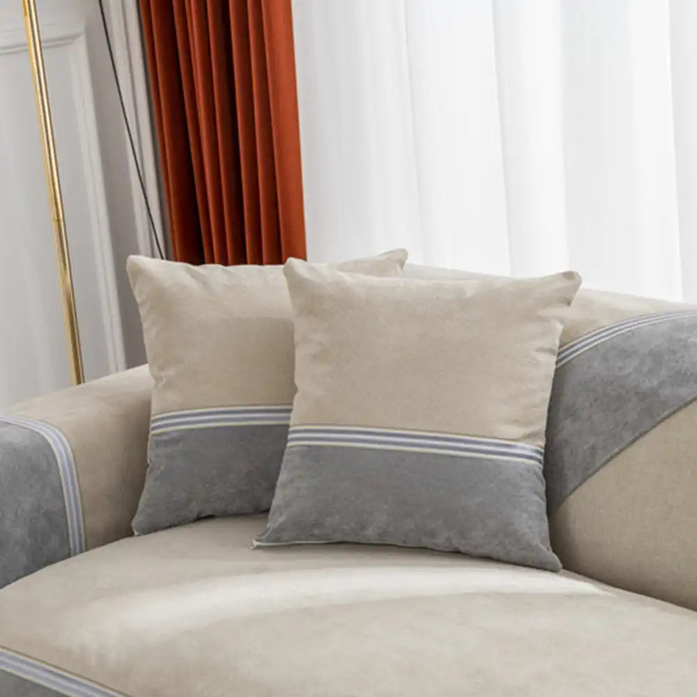 Packaged all-season water-resistant colorblock couch cover, ready for home decor and furniture protection.