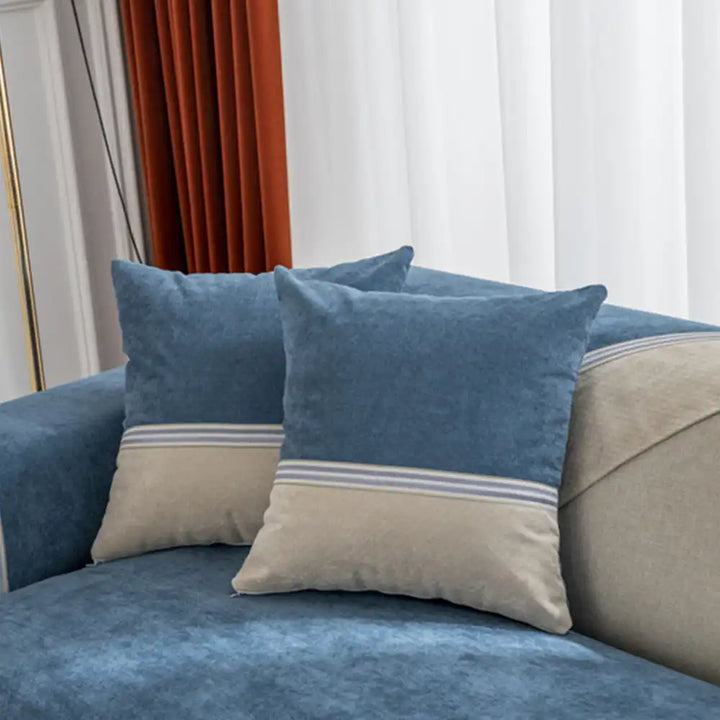 Close-up of the fabric texture of an all-season water-resistant couch protector, grey and white.