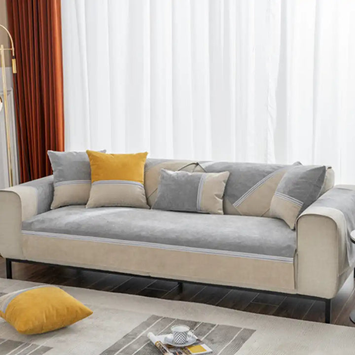 Machine washable colorblock couch cover, showcasing its easy-care and durable furniture protection.