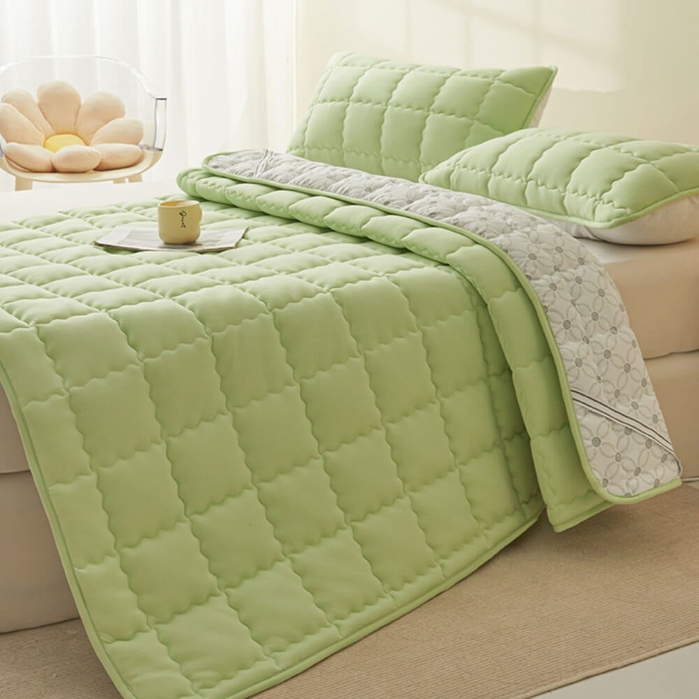 All-season non-slip mattress topper securely fitted to a bed, ensuring stable and comfortable sleep